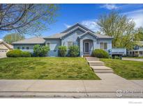 Charming single-Gathering home boasts a well-manicured lawn and inviting curb appeal in a quiet neighborhood at 3742 Florentine Cir, Longmont, CO 80503