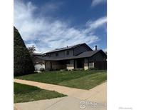 Charming home with a well-manicured lawn, solar panels, and inviting curb appeal on a sunny day at 5435 Tenino Ave, Boulder, CO 80303