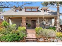 Charming two-story home featuring stone accents, dormer windows and professional landscaping at 721 9Th St, Boulder, CO 80302