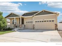 Charming single-Gathering home with a well-maintained lawn and a spacious three-car garage at 1471 Sabin Ct, Berthoud, CO 80513