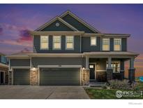Charming two-story home featuring a three-car garage and inviting front porch at 17101 Pecos St, Broomfield, CO 80023