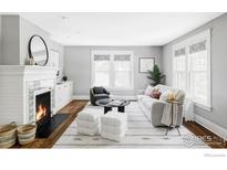 Bright living room boasts a fireplace, neutral colors, and abundant natural light at 2424 4Th St, Boulder, CO 80304