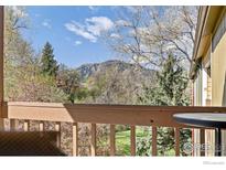 Enjoy mountain views from this home's balcony, surrounded by trees and nature at 2962 Shadow Creek Dr # 308, Boulder, CO 80303