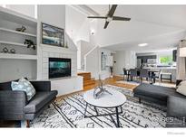 Bright living room boasts an open floor plan, fireplace, and modern decor at 5646 Rim Rock Ct, Boulder, CO 80301