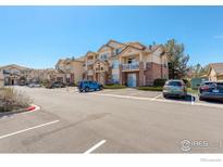 Attractive apartment complex featuring multiple units and ample parking at 5723 N Gibralter Way # 205, Aurora, CO 80019