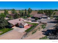 Expansive property featuring a home, barn, fenced yard, and picturesque views at 1241 River Glen Way, Berthoud, CO 80513