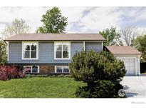 Charming home with well-maintained lawn, updated windows, and attached garage, offering curb appeal and practicality at 1013 Alsace Way, Lafayette, CO 80026