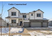 New construction home with a three-car garage, brick facade, white siding, and covered porch at 2710 Crystal Springs, Longmont, CO 80503