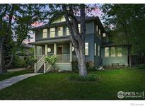 Charming two-story home with a covered front porch and well-manicured lawn at 3219 7Th St, Boulder, CO 80304