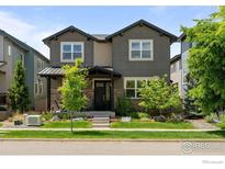 Charming two-story home with stone accents, a covered porch, and well-maintained landscaping at 3663 Silverton St, Boulder, CO 80301