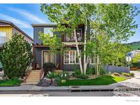 Charming two-story home with landscaped yard and a cozy front porch, perfect for relaxing outdoors at 5145 Denver St, Boulder, CO 80304