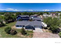 A well-maintained single-Gathering home featuring a spacious driveway and a neatly landscaped front yard at 10007 E County Line Rd, Longmont, CO 80501