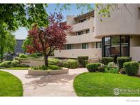 Well maintained building featuring inviting landscaping, manicured lawns and mature trees at 1140 Portland Pl # 303, Boulder, CO 80304