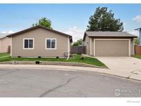 Charming home featuring a detached garage and well-maintained front yard at 9306 Ingalls St, Westminster, CO 80031