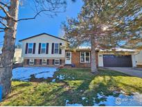 Charming two-story home with a well-maintained lawn and mature trees in a quiet neighborhood at 110 Lucerne Dr, Lafayette, CO 80026