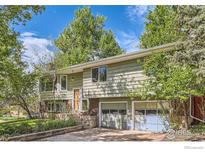 Charming two-story home with a well-maintained yard and an attached two-car garage at 4350 Butler Cir, Boulder, CO 80305