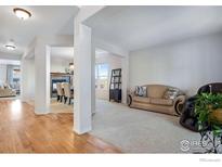 Inviting living room with neutral tones and an open floor plan at 6483 S Irvington Way, Aurora, CO 80016