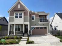 Beautiful two-story home with a covered porch and a two-car garage at 1591 Poplar Dr, Erie, CO 80516