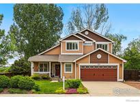Charming two-story home with a well-manicured lawn and inviting curb appeal at 301 Widgeon Ln, Longmont, CO 80503