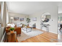 Bright living room featuring hardwood floors, ample seating, and stylish decor at 4035 Darley Ave, Boulder, CO 80305