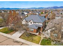 Charming two-story home with manicured lawn and mountain views, perfect for suburban living at 5017 Bella Vista Dr, Longmont, CO 80503