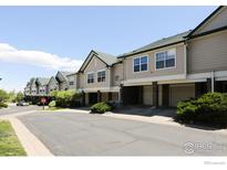 Inviting townhome showcasing well-maintained landscaping, attached garages, and neutral exterior paint at 2162 Concord Ln, Superior, CO 80027