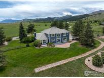 Stunning home with beautiful landscaping, brick patio and mountain views at 3159 Nelson Rd, Longmont, CO 80503