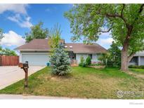 Charming ranch-style home with well-maintained lawn, mature trees, and inviting curb appeal at 8200 S Locust Way, Centennial, CO 80112