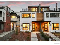 Modern home with a roof deck features clean lines, large windows, and unique wood and stucco accents at 2248 S Lincoln St, Denver, CO 80210