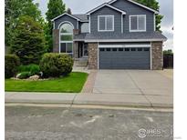 Charming two-story home with attached two car garage and manicured front yard at 12742 Clermont St, Thornton, CO 80241