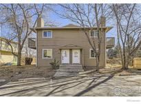 Two-story exterior featuring balconies and individual unit entry doors at 4529 Barnacle Ct, Boulder, CO 80301
