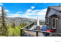 Outdoor deck with stunning mountain views, perfect for entertaining and enjoying nature at 1100 Deer Trail Rd, Boulder, CO 80302