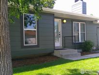 Charming single-Gathering home featuring fresh green lawn and a newly painted exterior with modern style railing at 1087 Lilac St, Broomfield, CO 80020