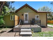 Charming home featuring a cozy front porch, complete with seating and decorative touches at 2200 Teller St, Lakewood, CO 80214