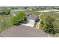 Charming single-Gathering home features a two-car garage and a spacious driveway on a large lot at 2875 Mooney Pl, Erie, CO 80516