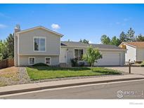 Charming two-story home with landscaped front yard and attached two-car garage at 1043 Lilac Ct, Broomfield, CO 80020