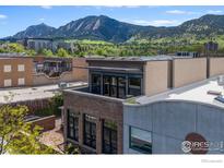 A stylish building boasts Flatiron Mountain views from its rooftop deck in a vibrant, walkable Boulder neighborhood at 1727 15Th St # 300, Boulder, CO 80302