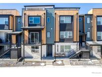 Modern townhouse featuring a unique exterior design and welcoming entryways at 2361 Junegrass Ln, Superior, CO 80027
