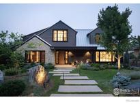 Inviting two-story home with stone accents, walkway, and well-manicured landscaping at 2828 4Th St, Boulder, CO 80304