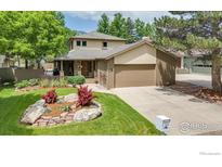 Charming two-story home featuring a landscaped front yard and an attached two-car garage at 3345 15Th St, Boulder, CO 80304