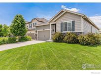 Charming single-Gathering home features a well-maintained lawn and inviting curb appeal at 6253 Black Mesa Rd, Frederick, CO 80516