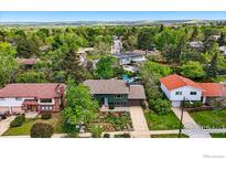 Charming home nestled among lush greenery, with views of the surrounding neighborhood and distant landscape at 1350 Lehigh St, Boulder, CO 80305