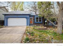 Charming single-Gathering home with a well-manicured front yard and a two-car garage at 247 Regal St, Louisville, CO 80027
