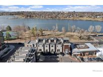 Modern townhomes with rooftop decks overlooking a scenic lake and green space at 4072 W 17Th Ave, Denver, CO 80204