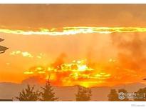 Scenic sunset view casting a warm glow over the landscape at 10818 Cimarron St # 1203, Firestone, CO 80504