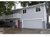 Charming two-story home with a balcony, two-car garage, and landscaped front yard at 1714 Zeus Dr, Lafayette, CO 80026