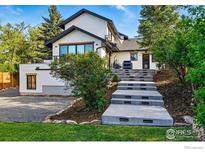 Charming two-story home featuring modern architecture and landscaped yard with concrete steps at 1801 Redwood Ave, Boulder, CO 80304