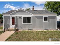 Charming single-story home with a well-maintained lawn and inviting front entrance at 201 4Th St, Frederick, CO 80530