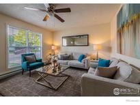 Comfortable living room with neutral tones, plush seating, and modern decor at 2230 Lincoln St, Longmont, CO 80501