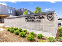 Modern building signage with landscaping in front of the office building at 3335 Broadway St, Boulder, CO 80304